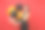 漂亮微笑的女人穿着小黑裙庆祝保持手在下巴上拿着气球孤立在红色的背景。情人节，新年快乐，生日模型节日派对概念。图片下载