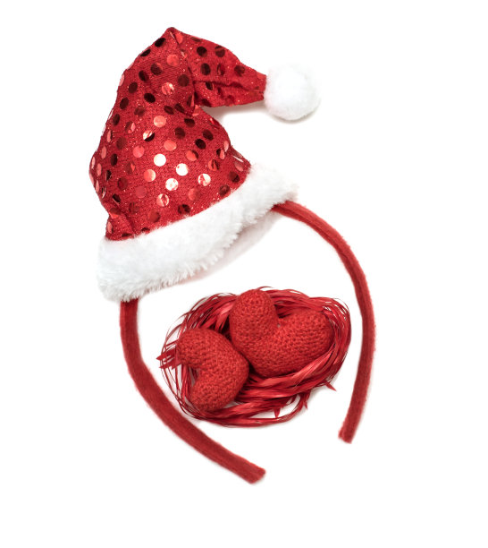 圣诞装饰用一顶红帽的圣诞老人和两颗心的白色图片下载