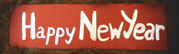 一个木制的复古招牌上的新年标志图片下载