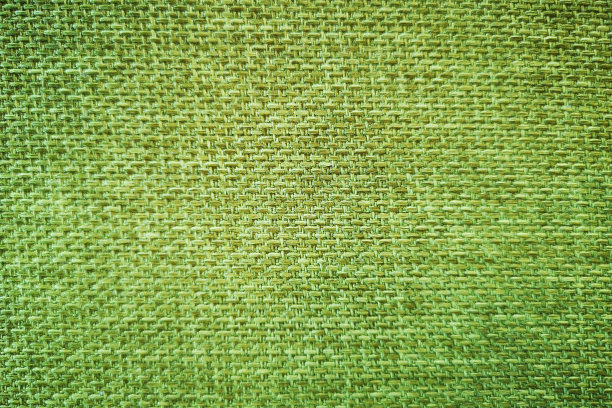 背景明亮的绿色布纤维和空白的文字。图片下载