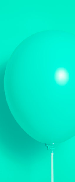 绿色气球在绿色背景和阴影。眩光。图片下载