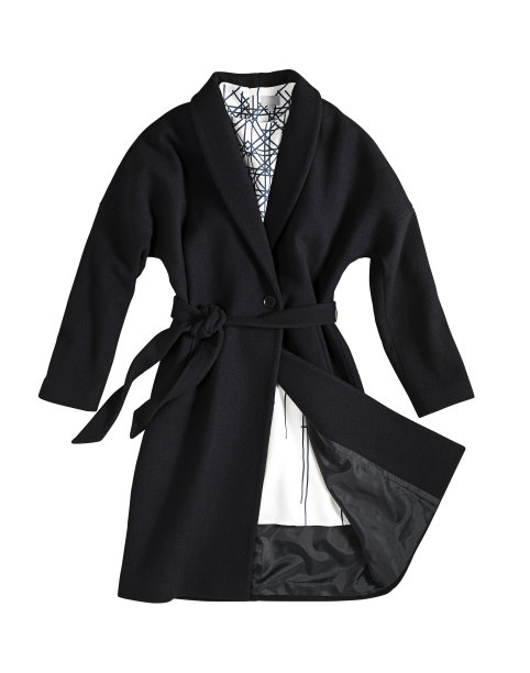 女式黑色大衣，裙摆以白色为背景(图片下载