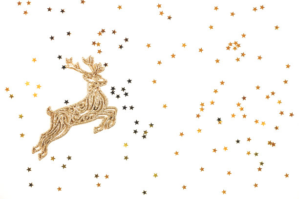 金色的圣诞鹿在金色的星星的背景。图片下载