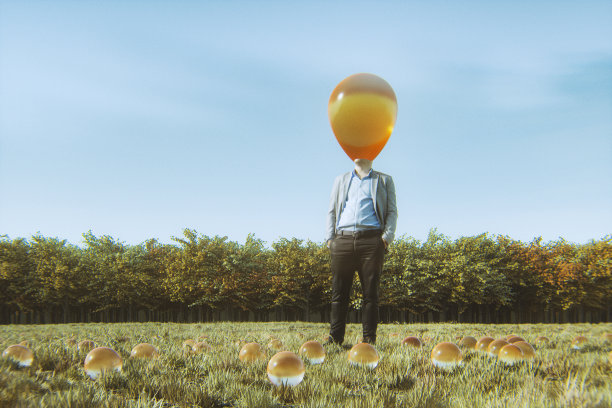 一个超现实的商人站在草地上图片下载