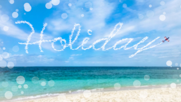 飞机在空中写假日。图片下载