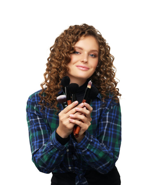 化妆。用刷子化妆的女人。选择性焦点(画笔)图片下载