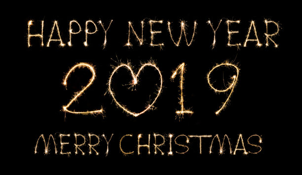 新年快乐2019圣诞快乐文字手工书写闪耀烟花与五颜六色的烟花图片下载