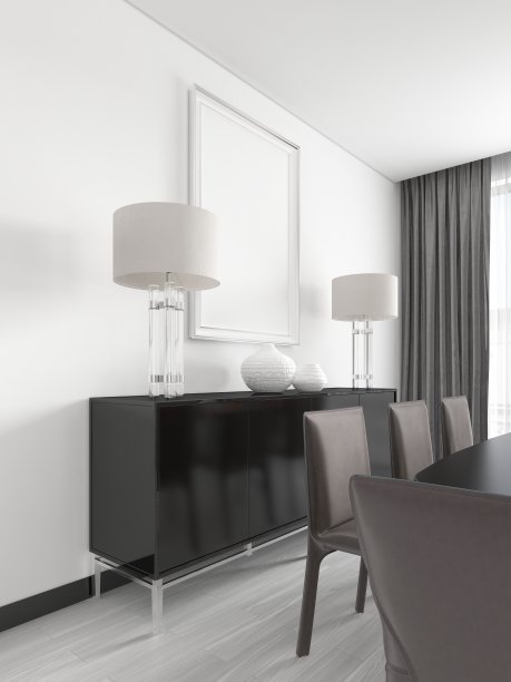 一个黑色的五斗橱，金属腿，夜灯，花瓶和上面的一张图片，动作捕捉海报。图片下载