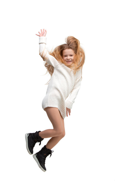 可爱的小女孩跳。影棚拍摄。白色背景图片下载