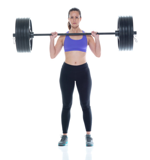 穿着运动服举重的漂亮女性图片下载
