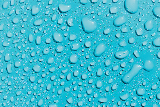 水滴在蓝色的表面，背景图片下载