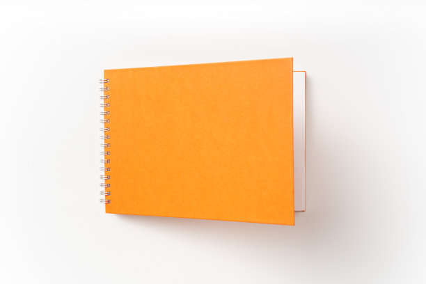 螺旋橙色笔记本与打开的封面图片下载