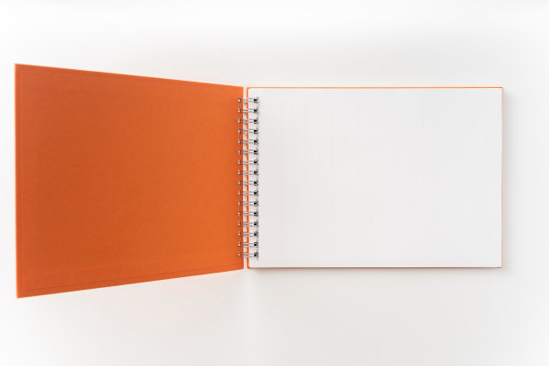 螺旋橙色笔记本与打开的封面图片下载