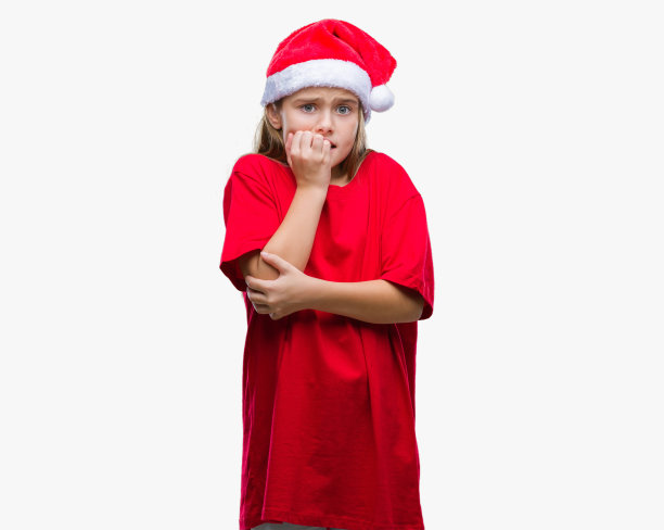 年轻美丽的女孩戴着圣诞帽在孤立的背景看起来紧张和紧张的手在嘴咬指甲。焦虑的问题。图片下载