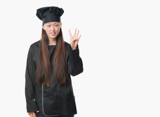 背景孤立的年轻中国女子穿着厨师制服，露出并指着第四个手指，微笑着自信而快乐。图片下载