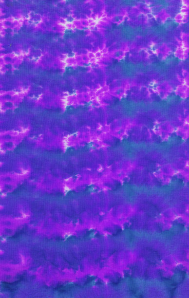 这是一张手绘扎染织物背景的照片，带有明亮的不规则斑点图案图片下载