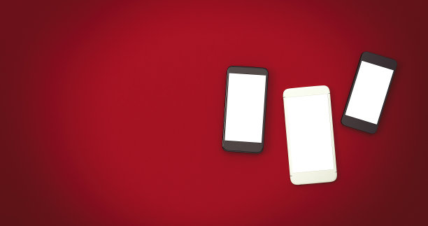 移动电话与白色的空间上的红色背景图片下载