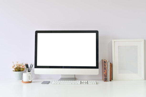 工作空间桌子办公用品在创造性的工作场所与模型电脑空显示。图片下载