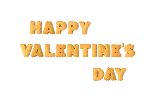 “快乐情人节”(HAPPY VALENTINE'S DAY)这个词的俯视图，由孤立在白色背景上的字母形状的饼干拼成图片下载