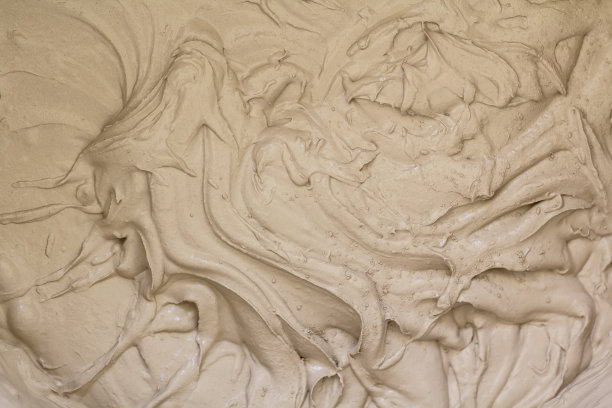 黄色的奶油漩涡纹理，用作背景图片下载