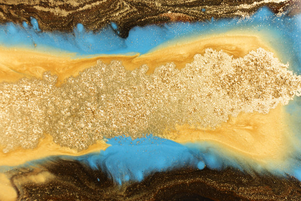 金色大理石纹理设计。蓝色和金色大理石图案。流体艺术。素材图片