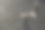 个人的长椅上。安装在城市广场上的一把椅子。现代城市环境中隐私和隐居的可能性。背光户外照片的不寻常的长凳，以路面的石头/鹅卵石为背景。图片下载