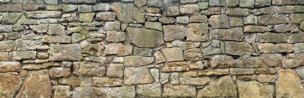 粗糙，非常古老的天然石墙图片下载