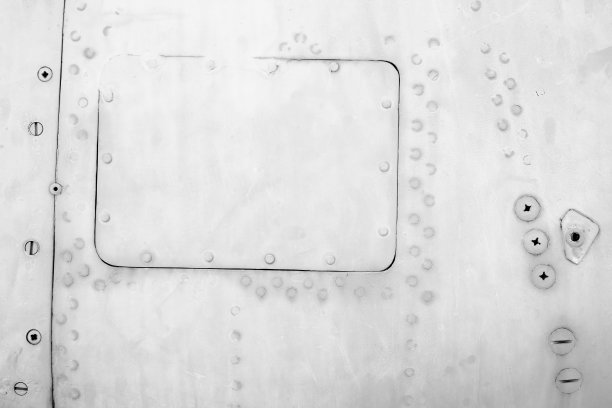 金属板与螺丝，旧的飞机机身，特写纹理背景图片下载