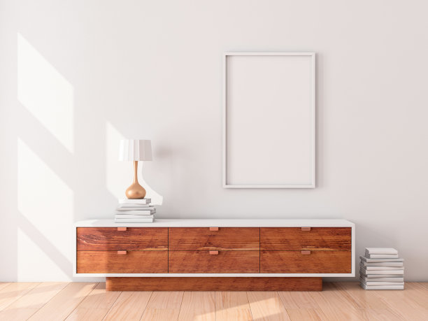 墙上挂着白色的招贴画，现代衣柜配有台灯和书籍图片下载