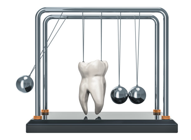 蛀牙的概念。牛顿带牙的摇篮。3D渲染孤立的白色背景图片下载