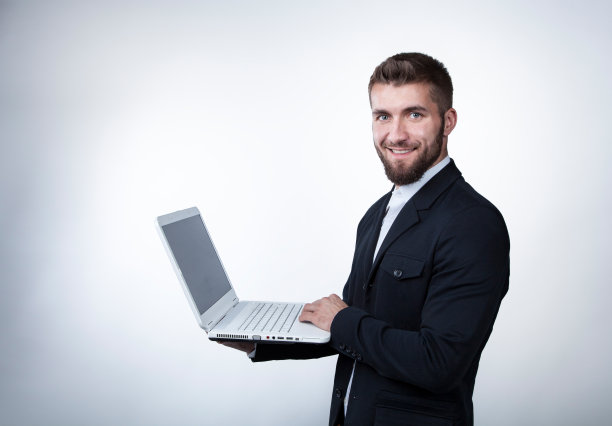 有魅力的商人拿着笔记本图片下载