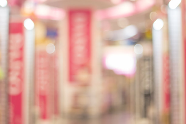 模糊图像的零售商店在购物中心为背景。图片下载