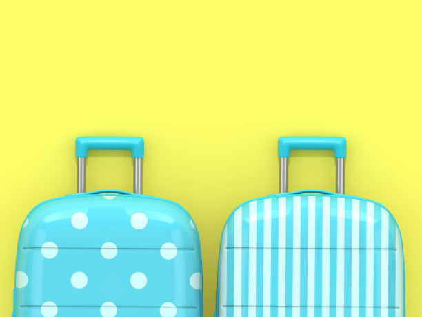 黄色背景上的两个手提箱的3d渲染图片下载