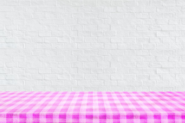 空顶格子桌布纹理与白色砖墙纹理背景。图片下载