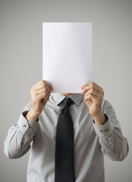 一个商人举着一个空白的牌子图片下载