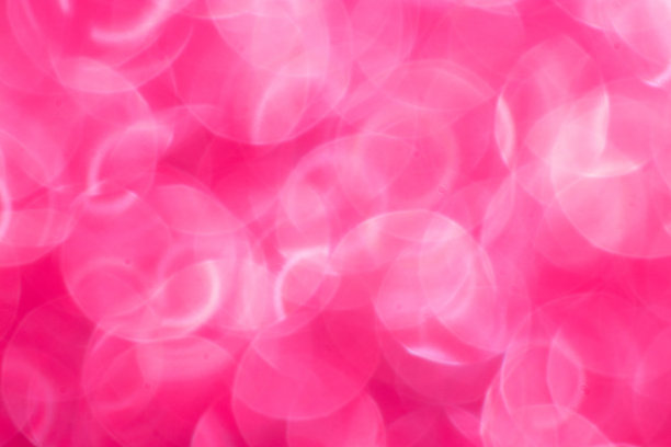 红色闪烁的节日背景与散景灯。庆祝概念的节日和周年素材图片