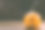 雕刻婴儿南瓜的特写照片在木制的背景与蜡烛光手套眼睛和嘴-孤立的对象模糊的背景，万圣节节日广告材料图片下载