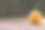 雕刻婴儿南瓜的特写照片在木制的背景与蜡烛光手套眼睛和嘴-孤立的对象模糊的背景，万圣节节日广告材料图片下载
