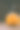 雕刻婴儿南瓜的特写照片在木制的背景与蜡烛光手套眼睛和嘴-孤立的对象模糊的背景，万圣节节日广告材料图片下载