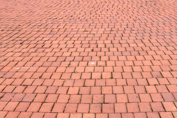 以红色石块为背景的石头路面。图片下载