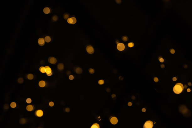金灿灿的星光和散景。抽象的背景。图片下载