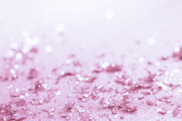玫瑰金色光泽纹理。节日闪闪发光的亮片背景特写。素材图片