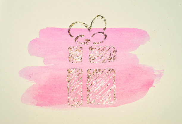 闪闪发光的礼物，盒子用丝带蝴蝶结在粉红色水彩圆形喷溅怀旧色彩，用金色的闪光图片下载