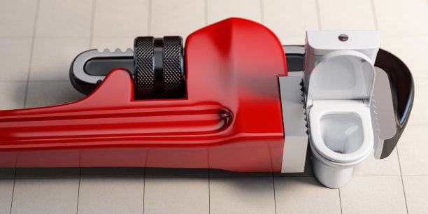 水管扳手和抽水马桶。管道维修服务。图片下载