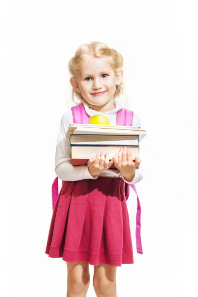 小女孩美丽时尚，快乐的在与世隔绝的背景下，回到了学校图片下载