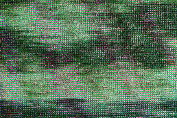 特写绿色与粉红色的织物纹理。织物图案设计或室内装潢抽象背景。图片下载