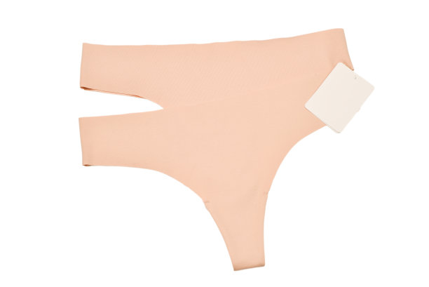 米色无缝内裤与标签孤立的白色。文字或设计空间。图片下载