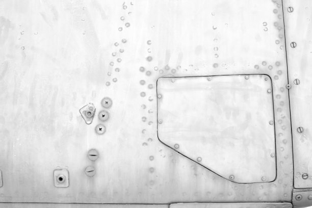 金属板与螺丝，旧的飞机机身，特写纹理背景图片下载