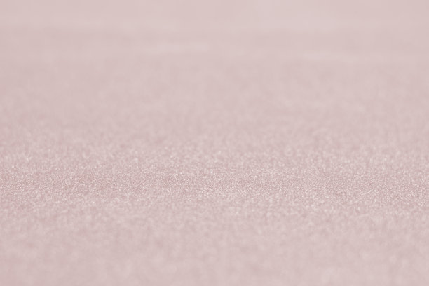 闪亮的火红粉箔玫瑰金颜色闪光装饰纹理纸:明亮灿烂的节日金属纹理空壁纸背景:锡金属材料为节日工艺设计装饰图片下载