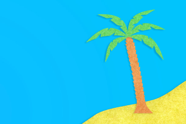 蓝色的桌子上，纸上剪出一棵带叶子的棕榈树和一个黄色的小岛。前视图。极简主义概念-形象。为你的文本复制空间图片下载